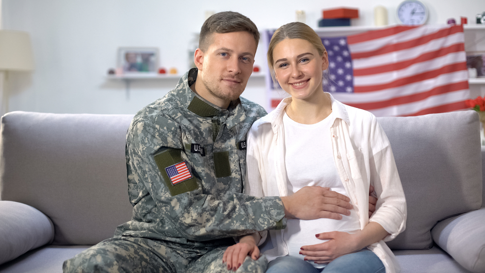 Military Officer Patting Pregnant Wife Belly