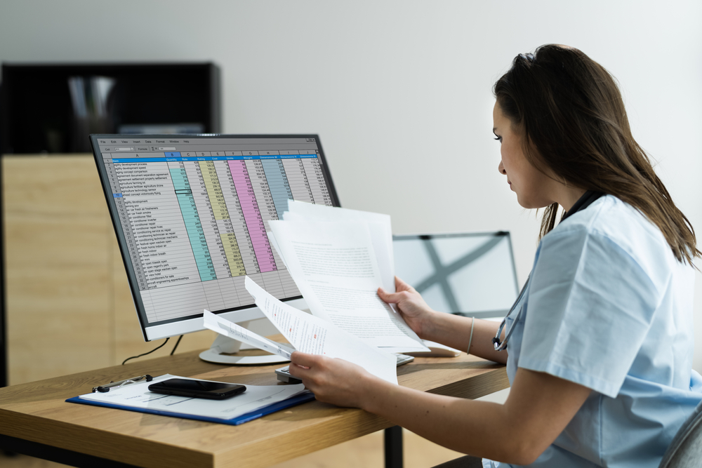 Woman looking at paperwork for medical billing